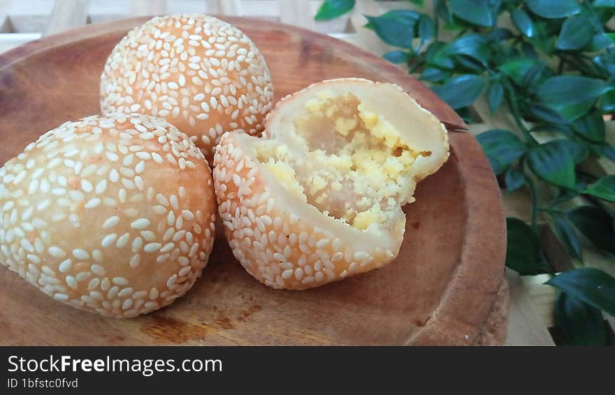 Onde-onde is a traditional Indonesian cake made from glutinous rice flour and filled with sweet green beans