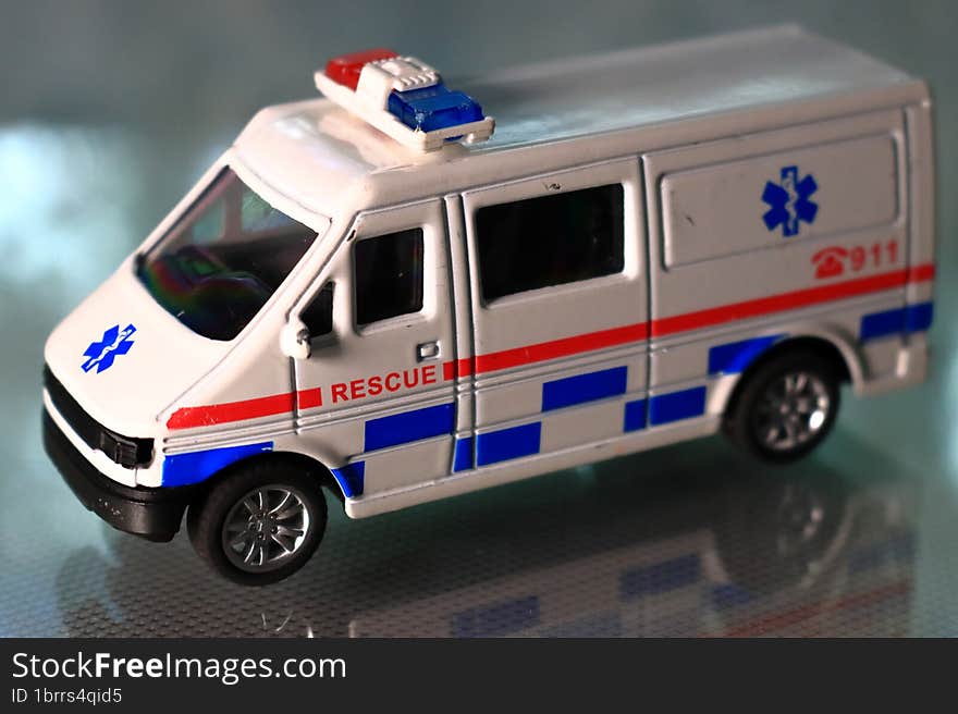 Hospital Rescue Ambulance Diecast Metal Car Model, blurred background.