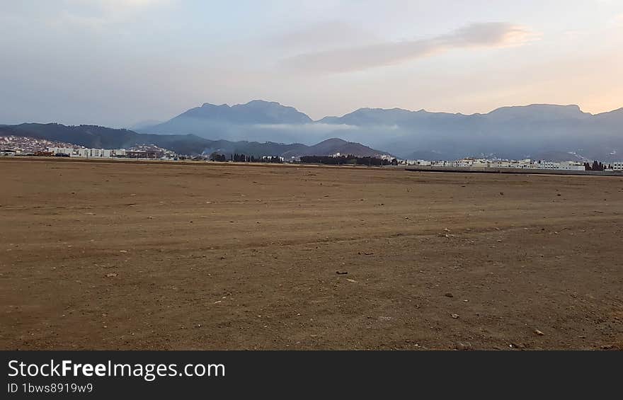 Barren wasteland exploring a large area of soil devoid of grass