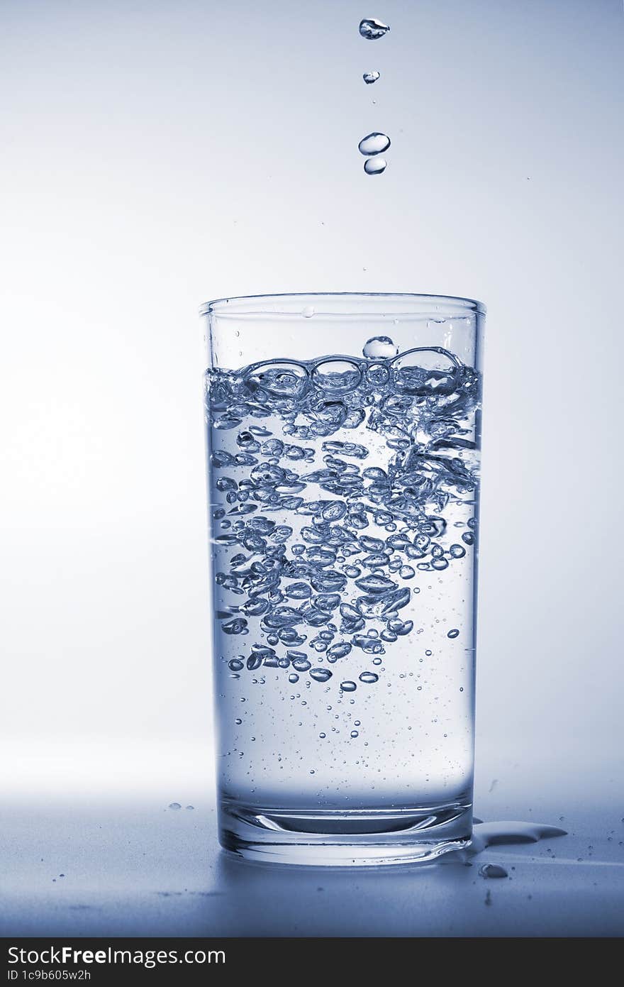 A Glass Fullfill With Pure Water With High Speed Shutter.