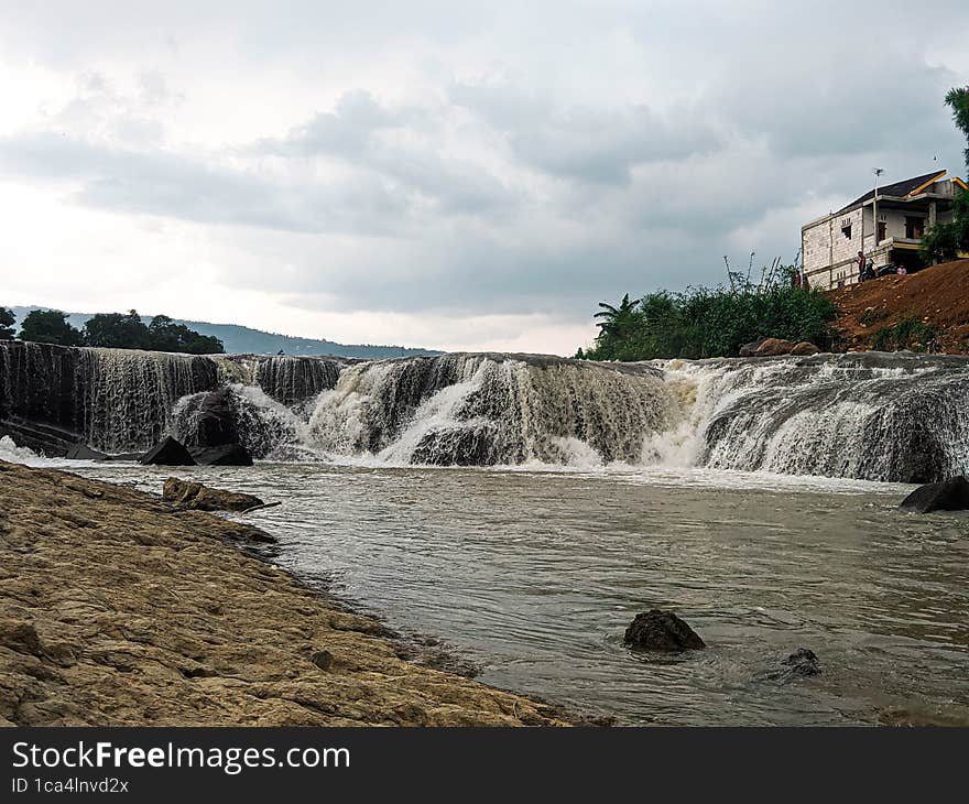 landscape view of waterfall on river