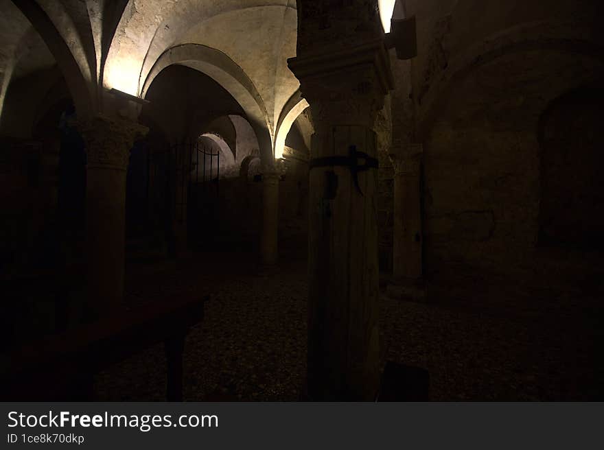 Crypt with benches and altar in the old dome of Brescia