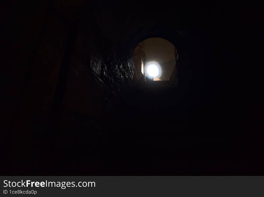 Staircase in a crypt that leads to the main nave of a church