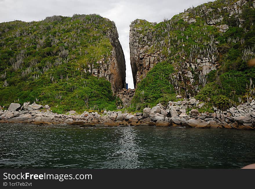 Cabo Frio beach in Rio de Janeiro Brazil, mountain cracked in the middle