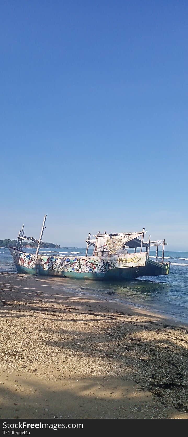 Broken fishing boat, left to be destroyed by nature