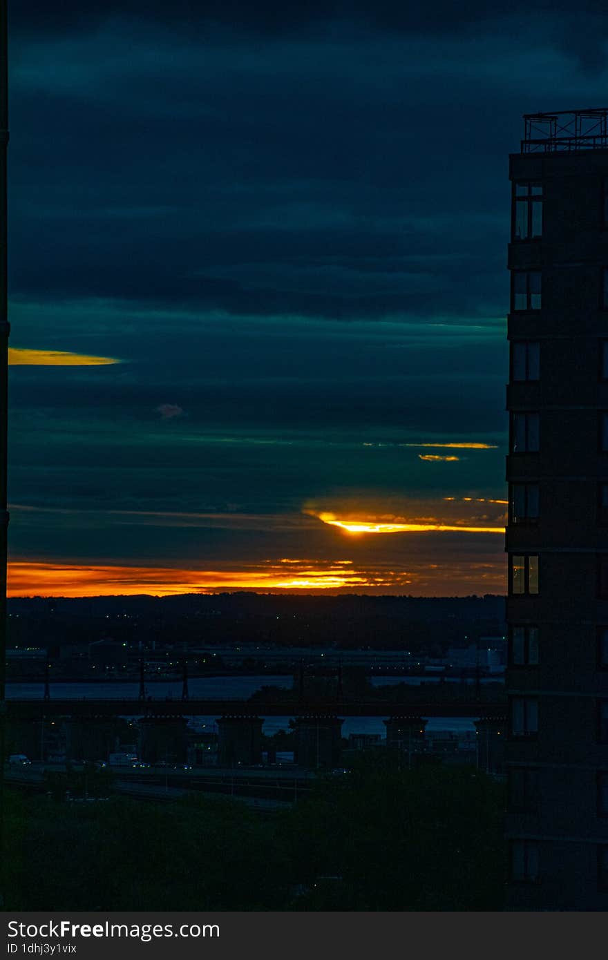 A dark navy aquamarine and orange sunrise on the upper east side of Manhattan, New York