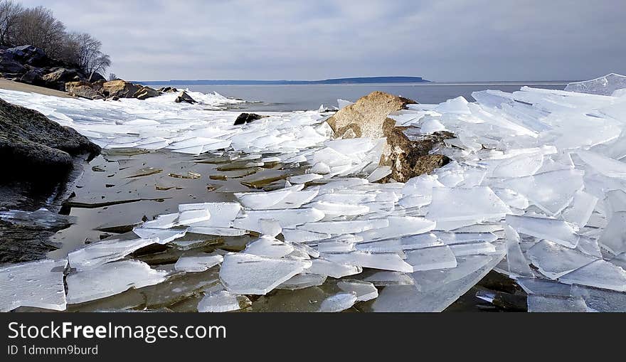 Shards of ice falling on the seashore