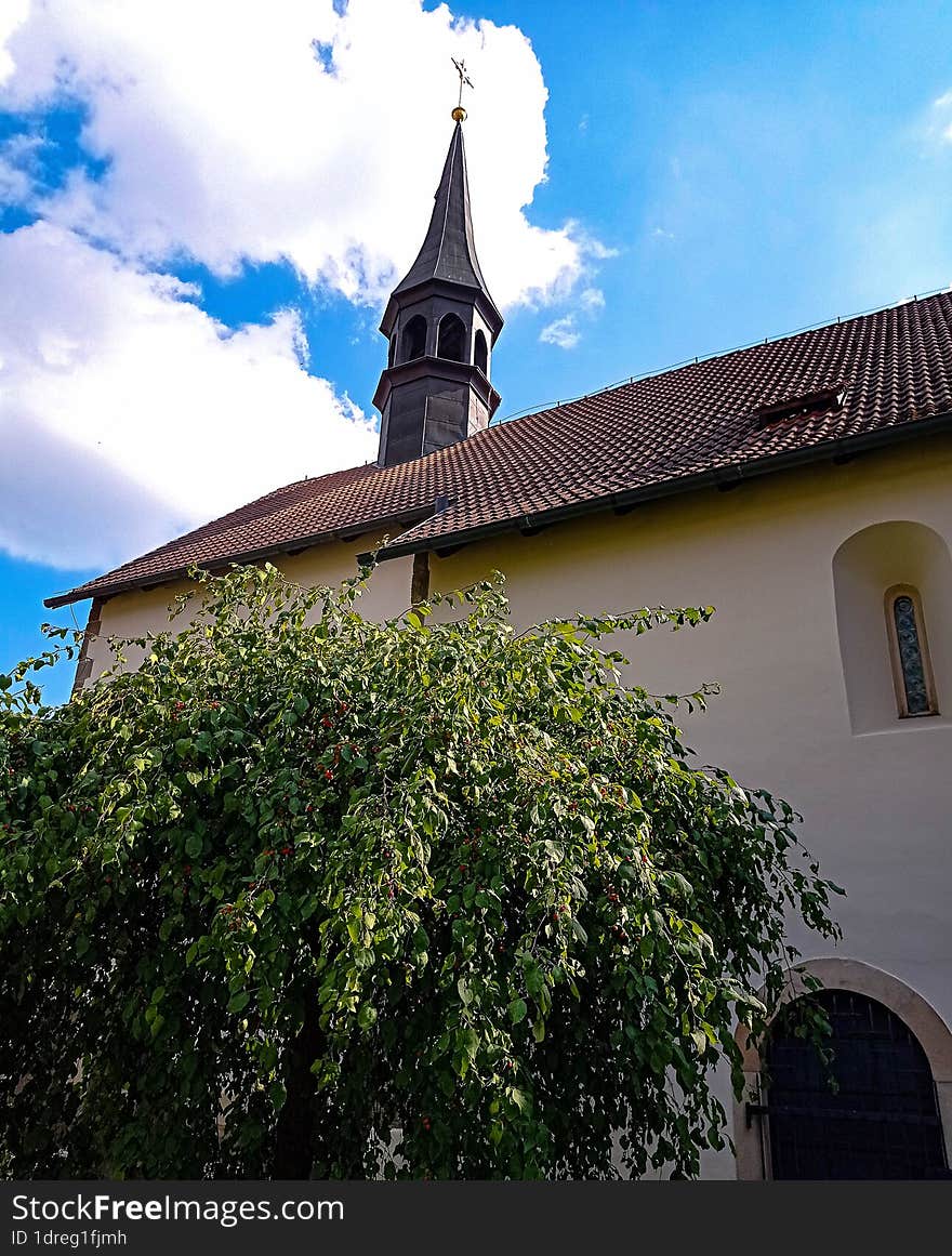 The church spire looks straight into the sky.