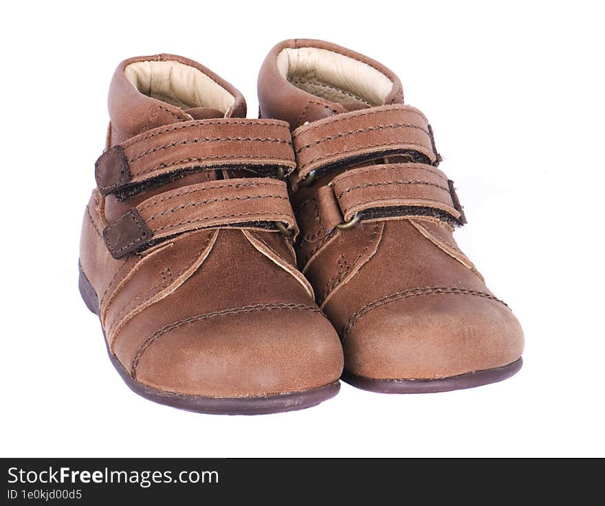 Pair children& x27 s boots on a white background