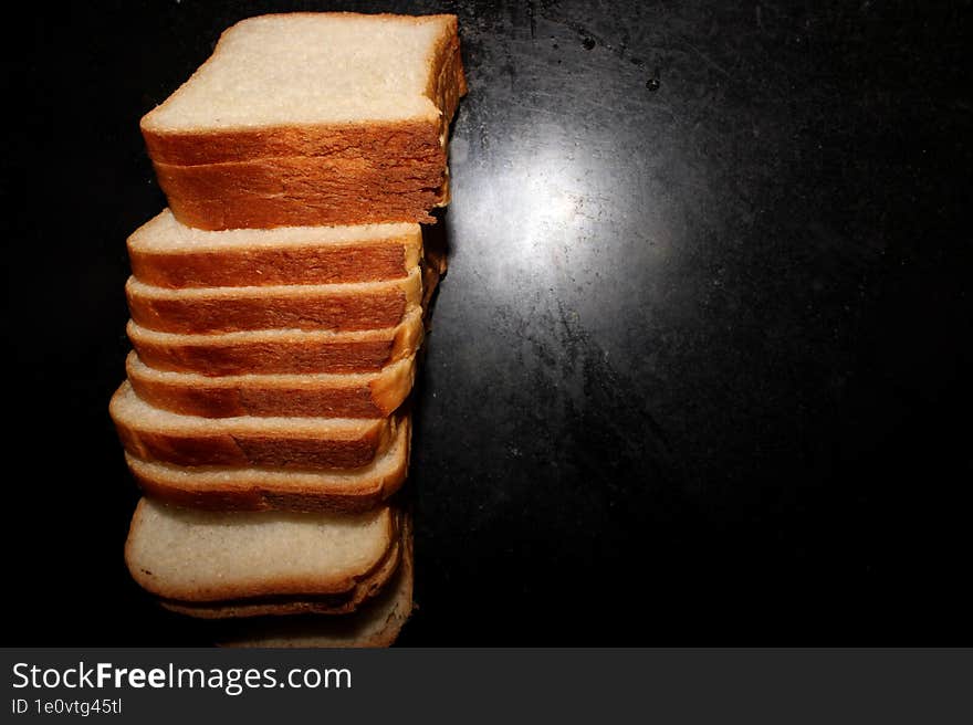 Bread Pieces on Black Background