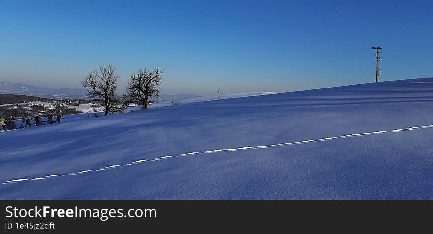 twilight on snowy hills and footprints