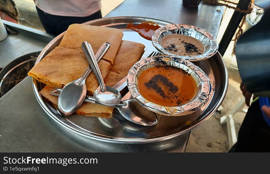 This is a closeup shot of one of the most famous Indian South Indian Foods Dosa and Chutney