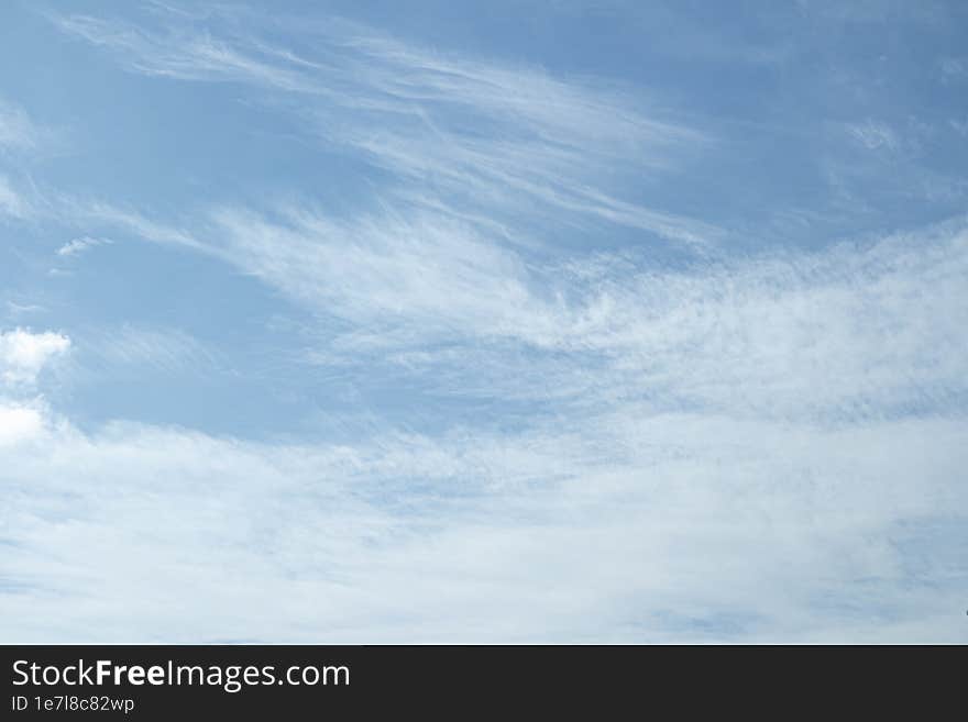 Transparent high clouds in summer background.