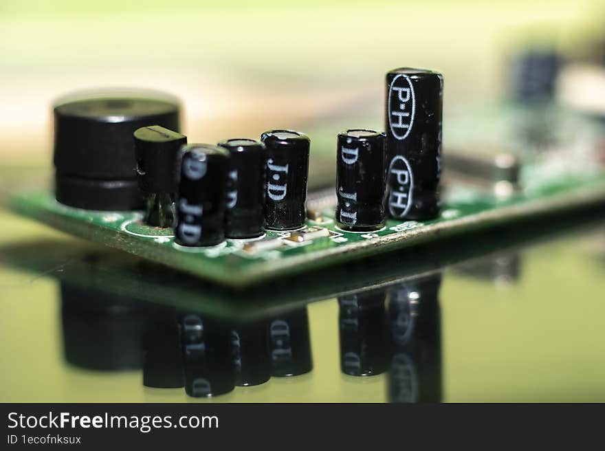A macro shot of capacitors in electric board