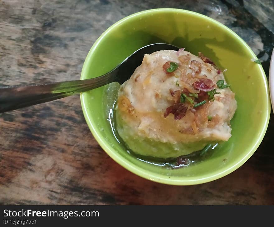 Meatball served in a green bowl