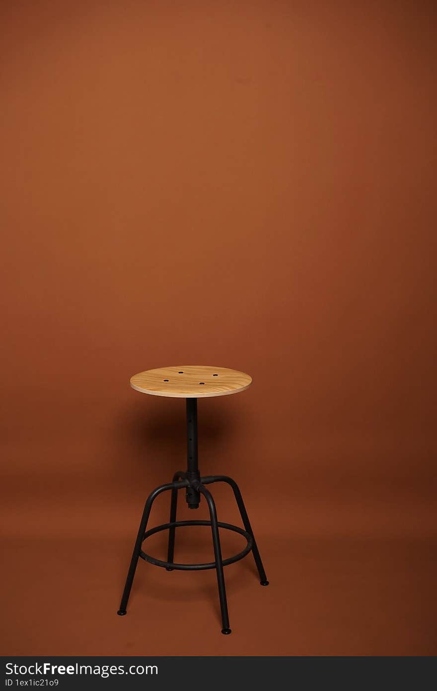 studio photography brown background and chair