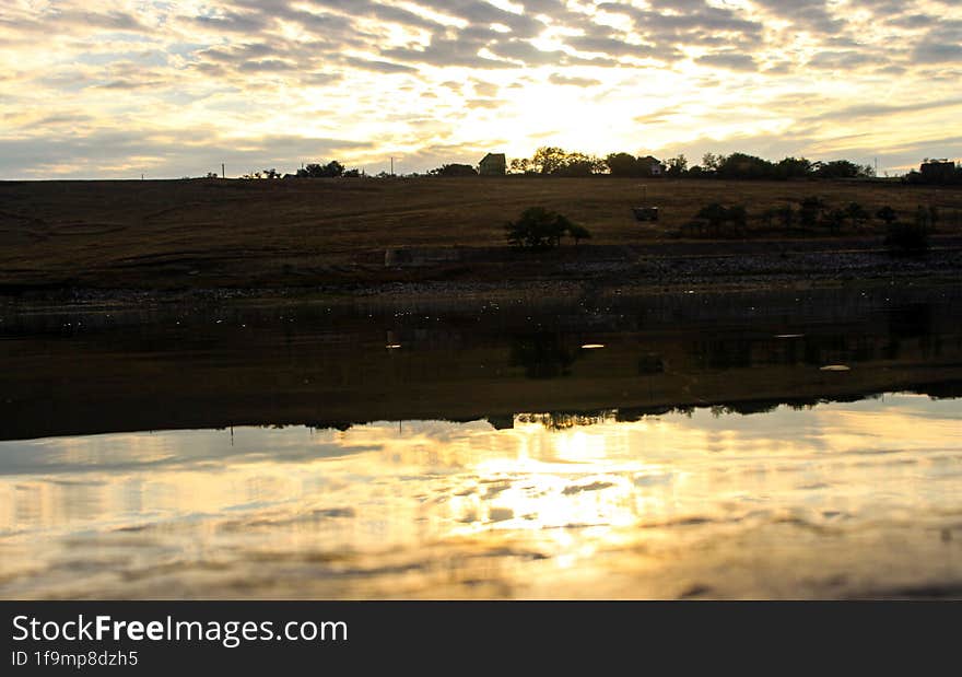 The Sunrise Seen From The Edge Of The Lake