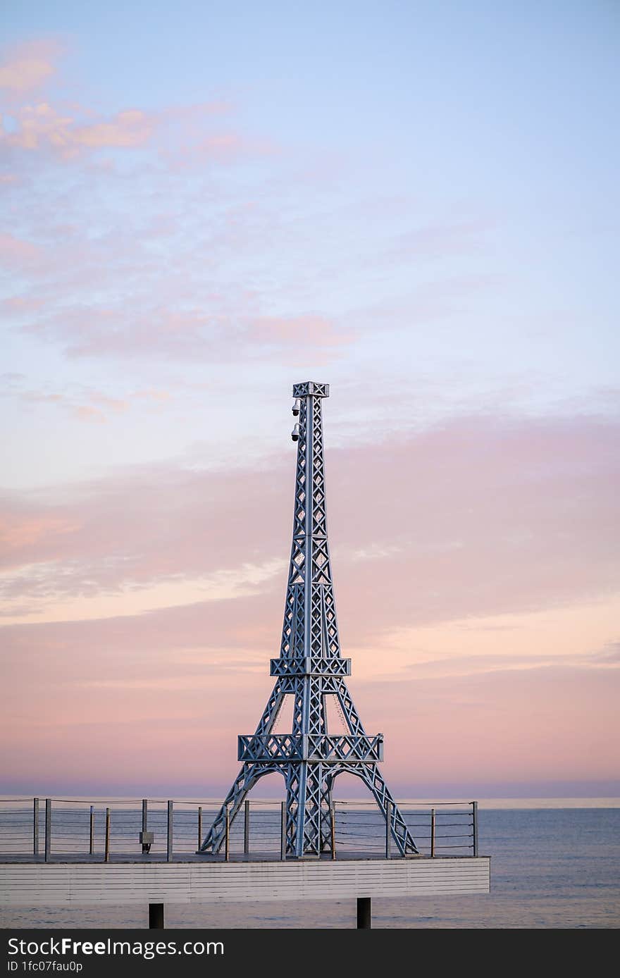 View of the prototype of the Eiffel Tower on the pier near the sea.