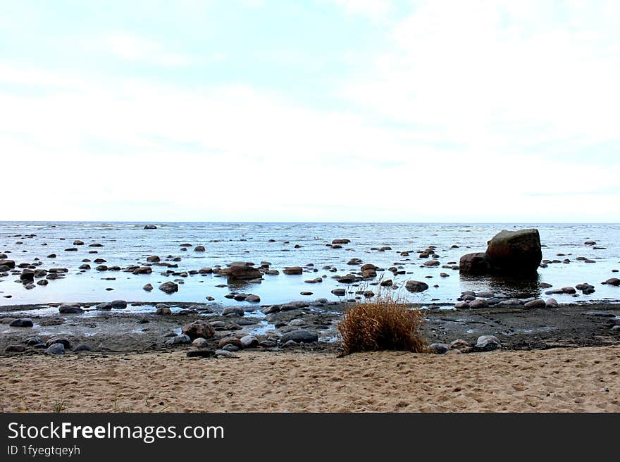 Muhu strait, Estonia, Baltic sea. Dramatic sky, storm clouds, water surface texture. Panoramic view. Nature, eco tourism, weather themes