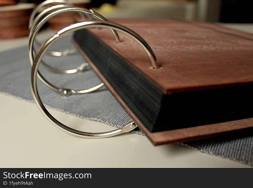 Vintage wood book on the table. Book on a desk. old wooden book. Photoalbum album. ring mechanism for a book