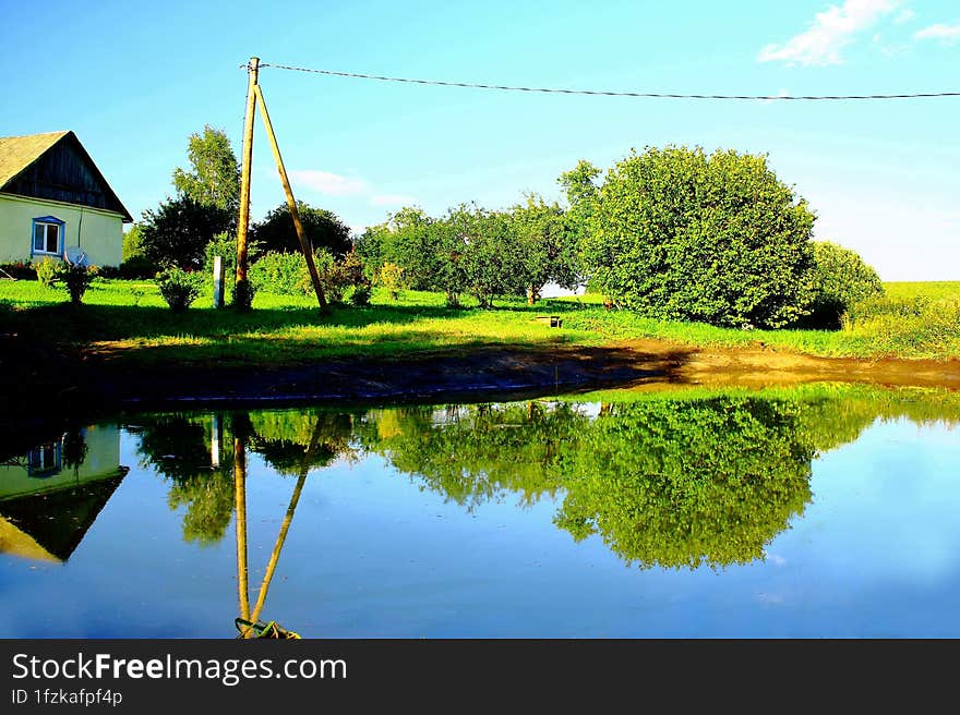 Village Pond In Latvia In Summer.