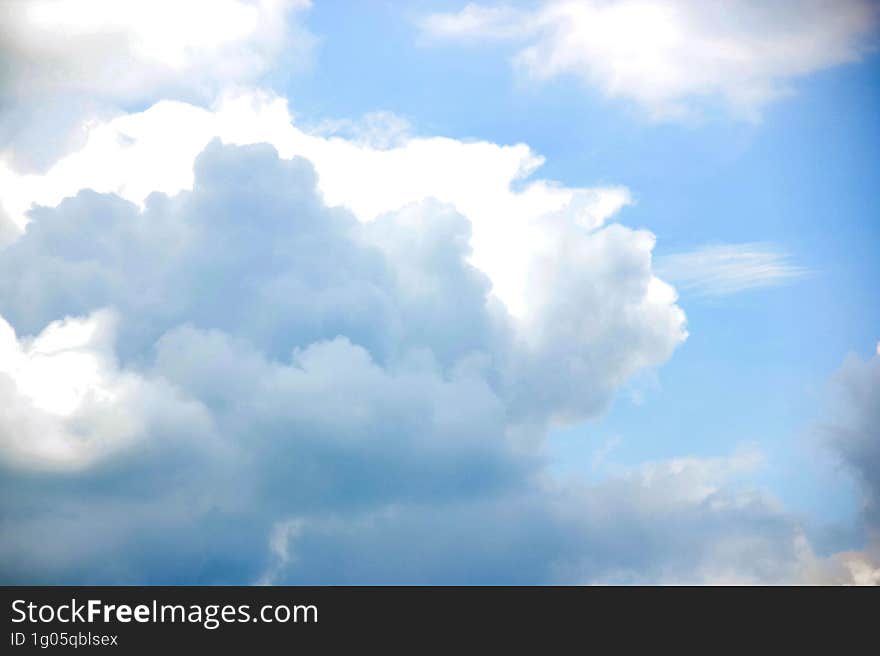 blue sky with white clouds and sun ray, nature cloudscape background. blue sky with white clouds and sun ray, nature cloudscape background