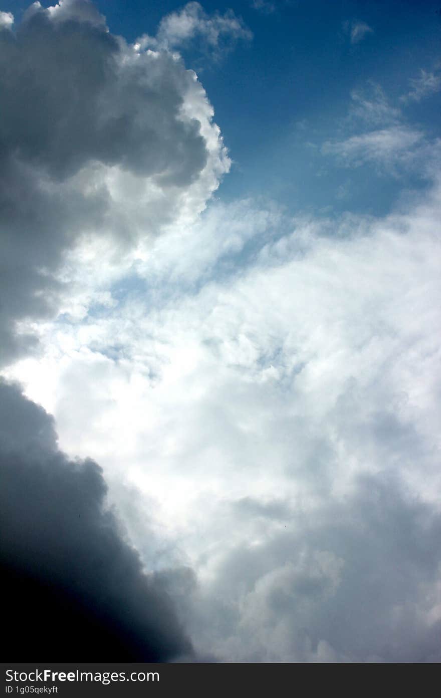 blue sky with white clouds and sun ray, nature cloudscape background. blue sky with white clouds and sun ray, nature cloudscape background