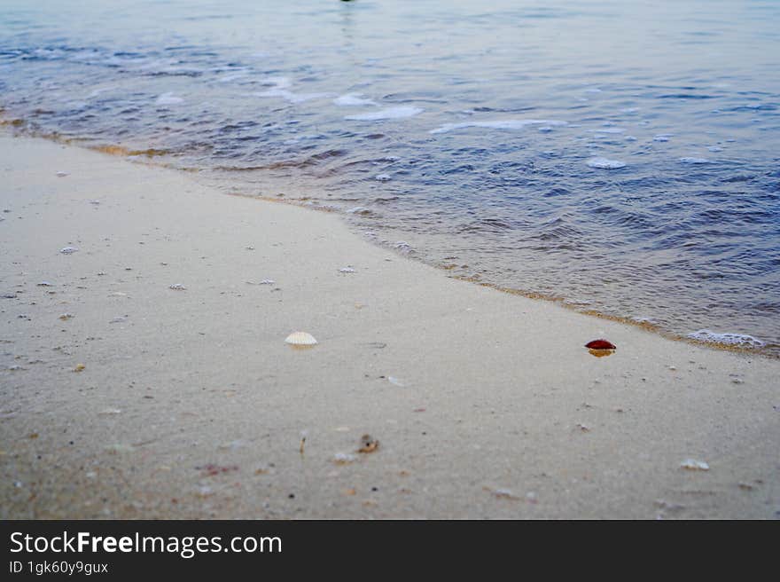 close-up view of small waves on the shoreline.