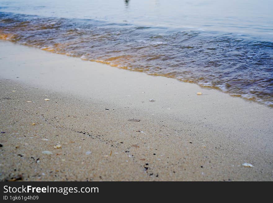 close-up view of small waves on the shoreline.