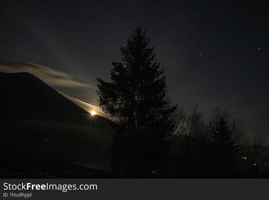 Nightview from Colibita, Bistrita, Romania. Moonrise behind the mountains