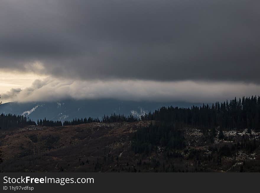 Mountain view from Bistrita, Romania. Moonrise behind the mountains. Mountain view from Bistrita, Romania. Moonrise behind the mountains