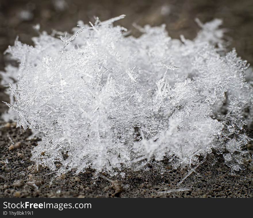 Macro photo of some snow crystals. Colibita, Bistrita-Nasaud, Romania. I used AI to remove noise.