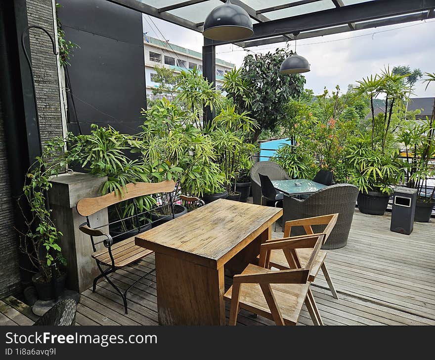 The Outdoor Terrace With Plants Is Suitable For Relaxing