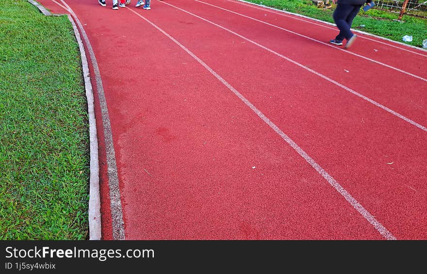 Running Track In The Stadium With A Surface Suitable For Runners& X27  Shoes, Attractive Colors With A Combination Of White Lines,