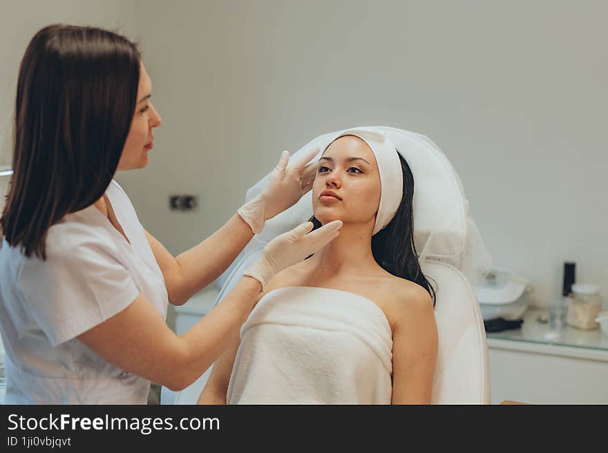 girl at a cosmetologist's office doing skin cleansing. High quality photo