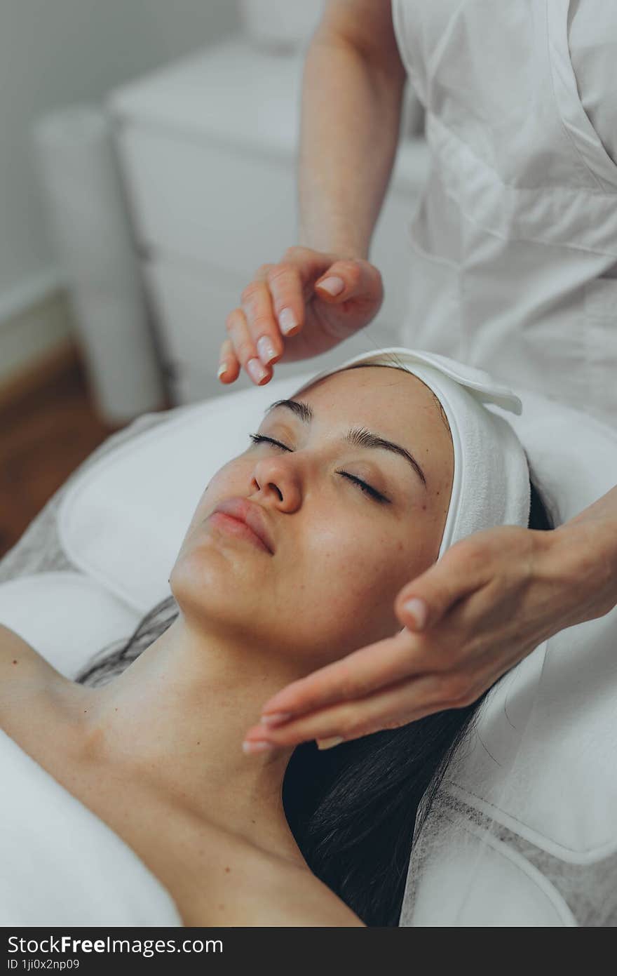 girl at a cosmetologist s office doing skin cleansing