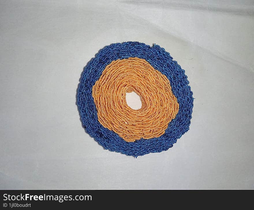 Orange and blue fabric pattern on white background