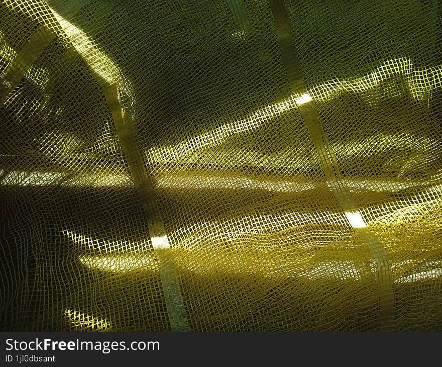 Sunlight reflection background, light on plastic net