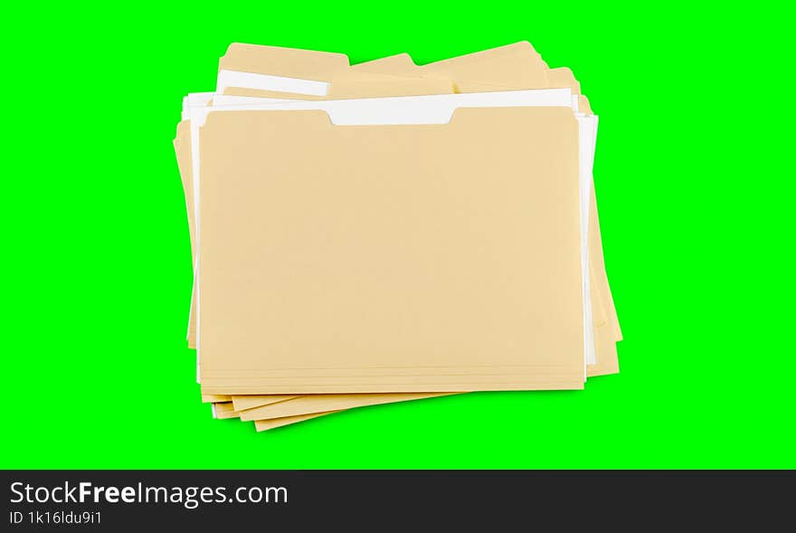 A Stack Of  Folders With Blank Labels On A Green Background. Chroma Key.