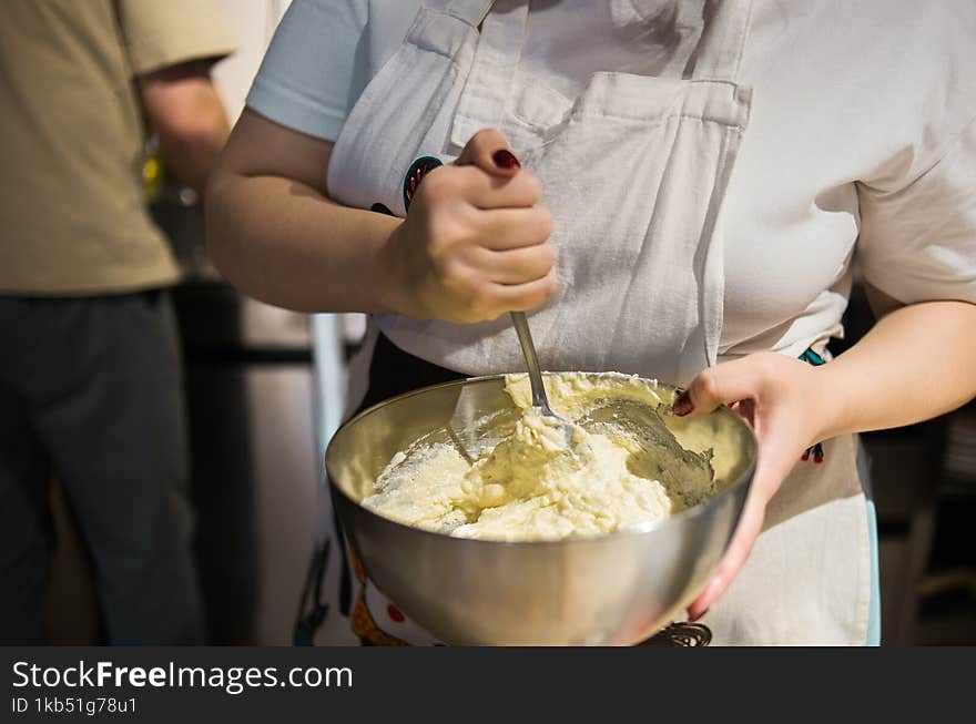 A Woman Makes Dove At Her Kitchen