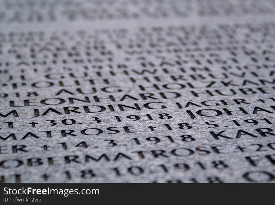 Inscriptions on gray stone.