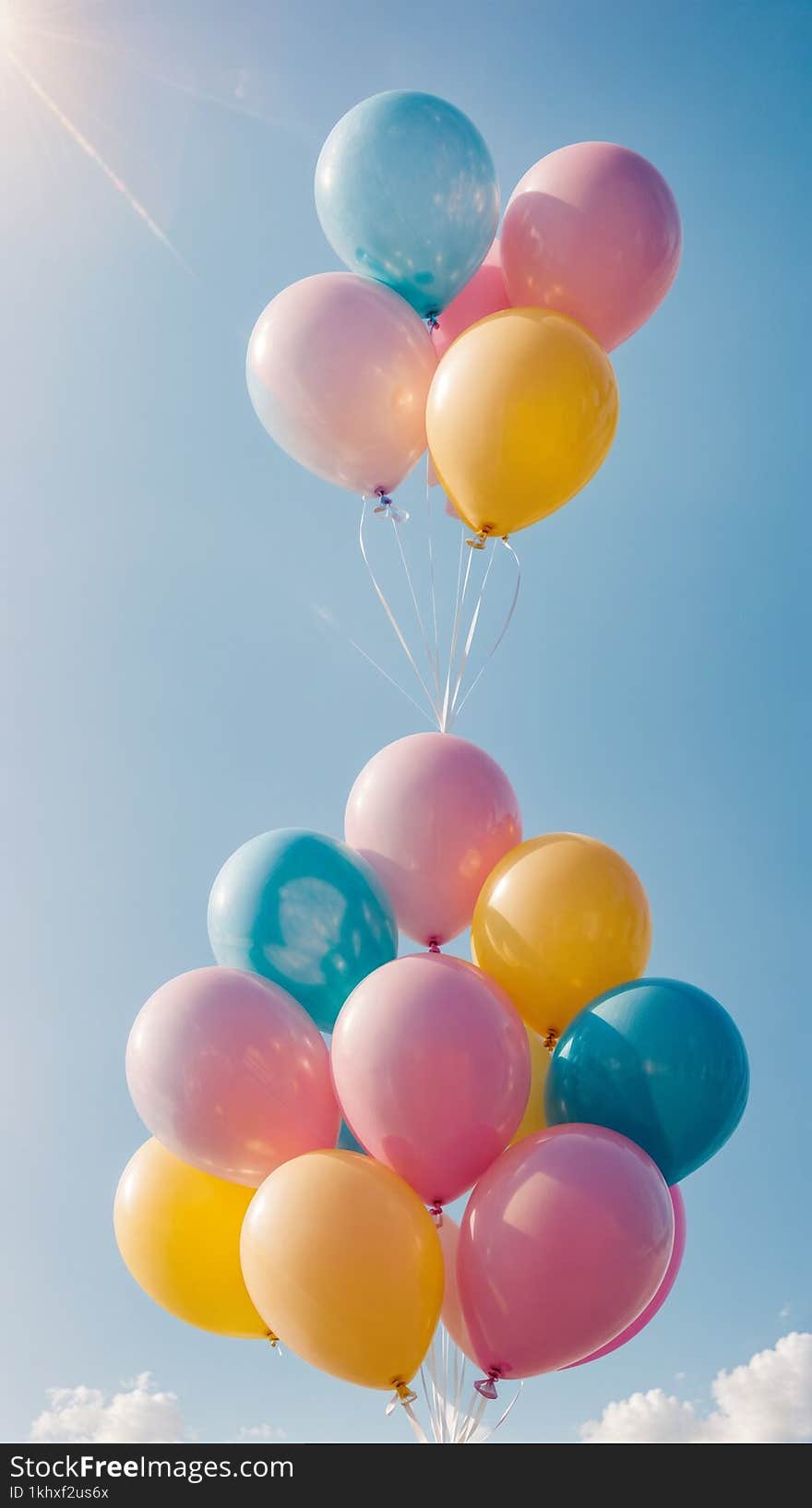 This cheerful and vibrant image features a bunch of colorful balloons floating in a clear blue sky. The pastel balloons, in shades of blue, yellow, and pink, create a joyful and uplifting atmosphere. The soft sunlight adds a radiant glow to the balloons, making this image perfect for various projects such as greeting cards, event decorations, and festive graphic design needs. This cheerful and vibrant image features a bunch of colorful balloons floating in a clear blue sky. The pastel balloons, in shades of blue, yellow, and pink, create a joyful and uplifting atmosphere. The soft sunlight adds a radiant glow to the balloons, making this image perfect for various projects such as greeting cards, event decorations, and festive graphic design needs.