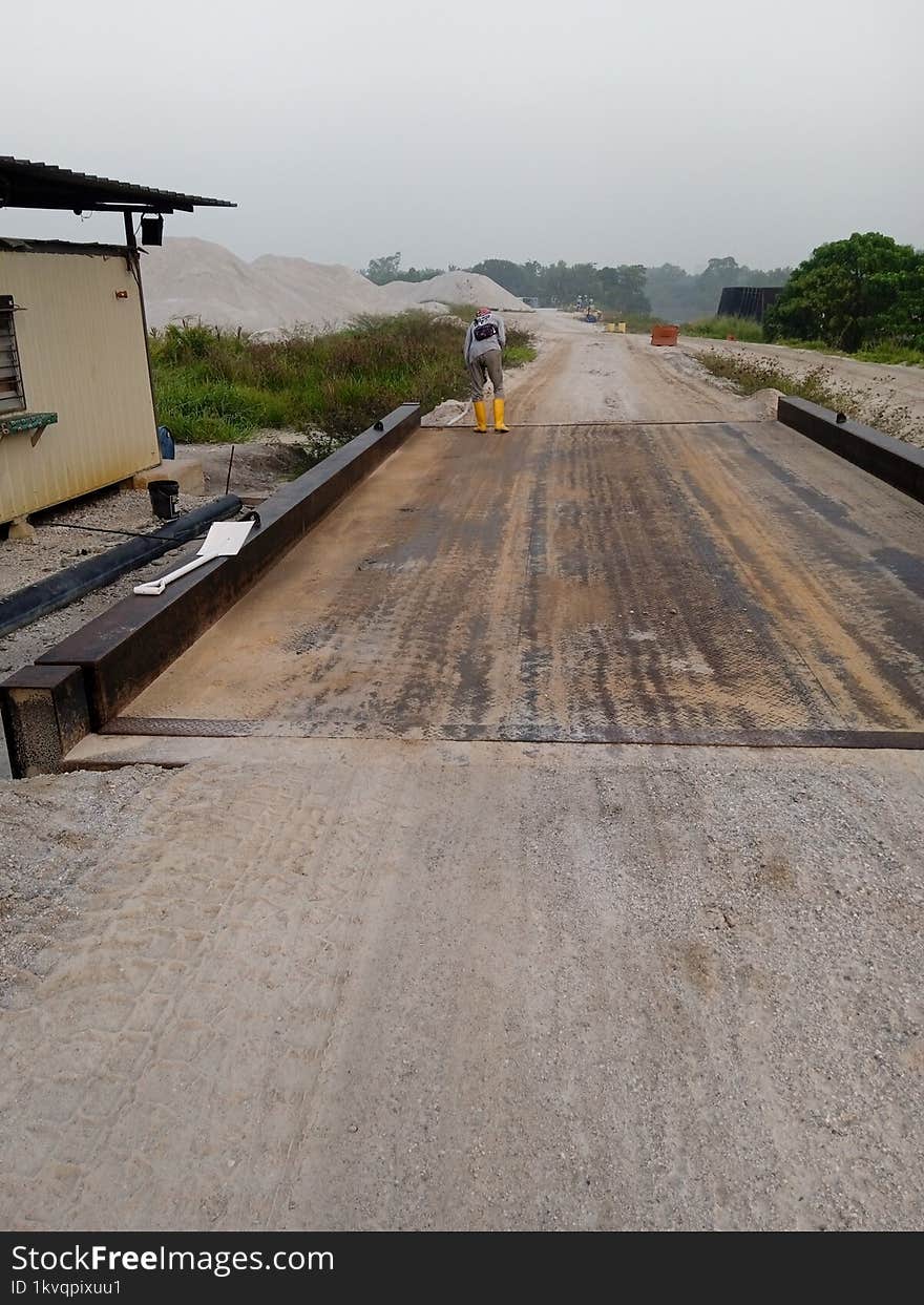 Weighbridge worker on construction area