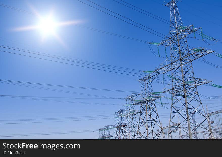 Transmission line support on blue sky background