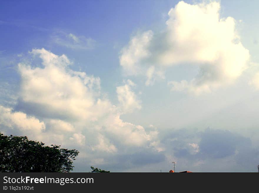 A photo that focuses on cumulus clouds during the day in summer, these clouds are always up there every afternoon and make the sky look beautiful and colorful. A photo that focuses on cumulus clouds during the day in summer, these clouds are always up there every afternoon and make the sky look beautiful and colorful.