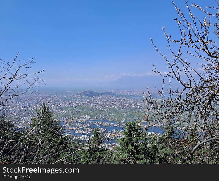 High Angle View Of Kashmir City,  Against Blue Sky And Tree, River.