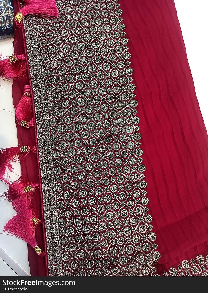 Red color saree.Beautiful looking color.With traditional emrodry