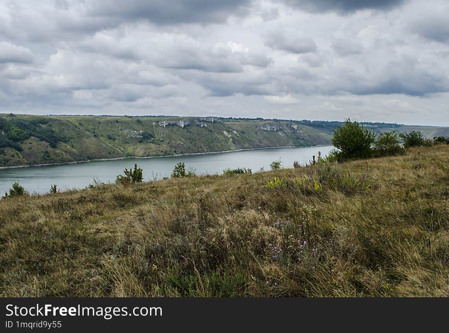 Landscape of Bakota River and mountains Ukraine Dniester River. Photo of the flooded village.   .   .