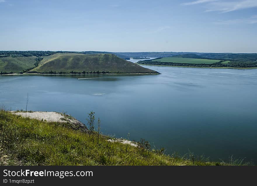 Landscape of Bakota River and mountains Ukraine Dniester River. Photo of the flooded village.   .