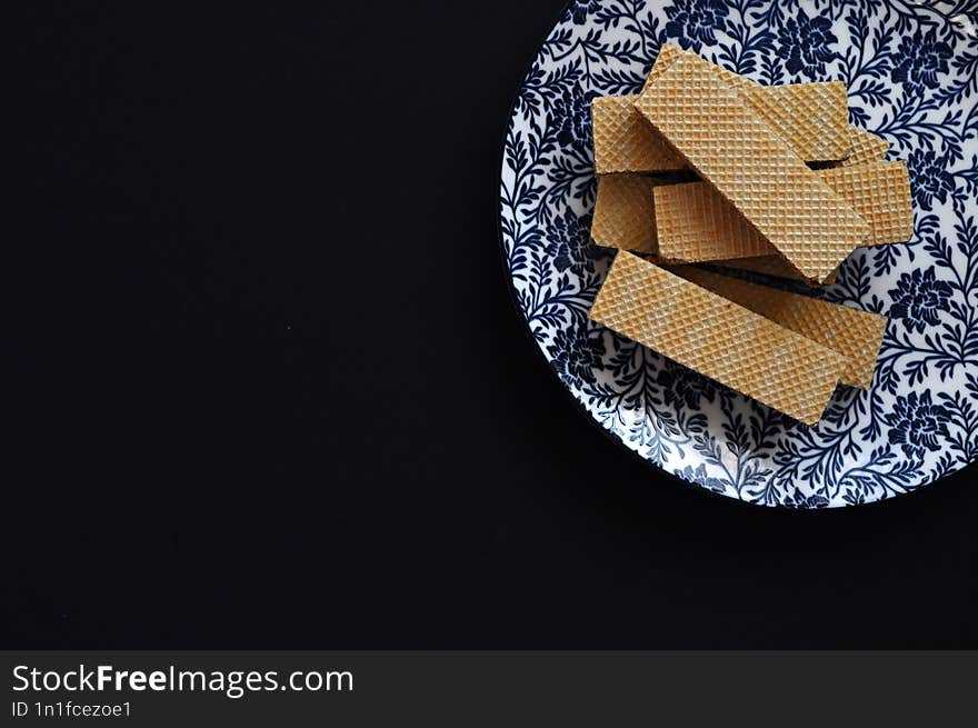 cookies on plate with black background